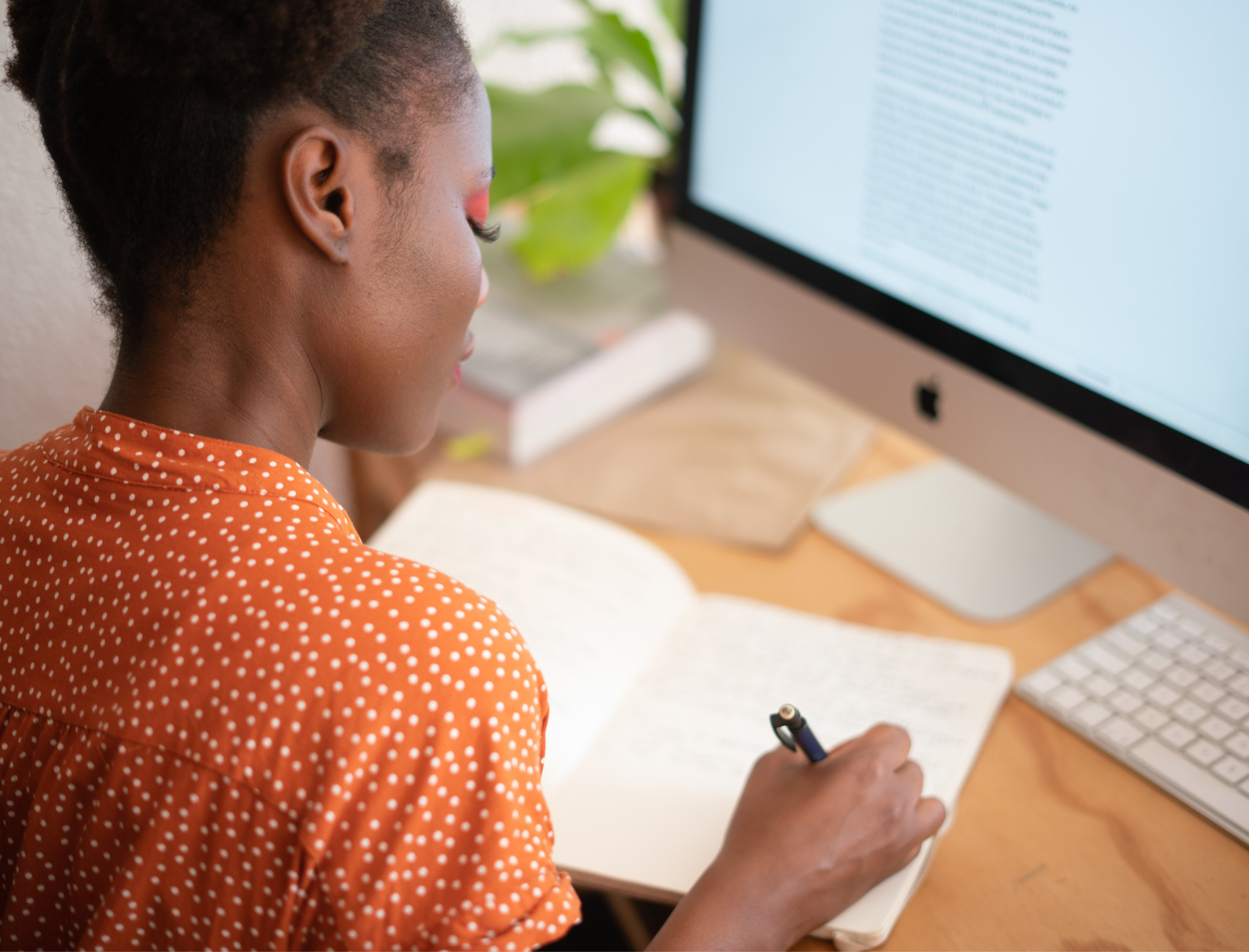 A woman types at her computer. Learn how to become a thought leader with Publish Your Purpose.