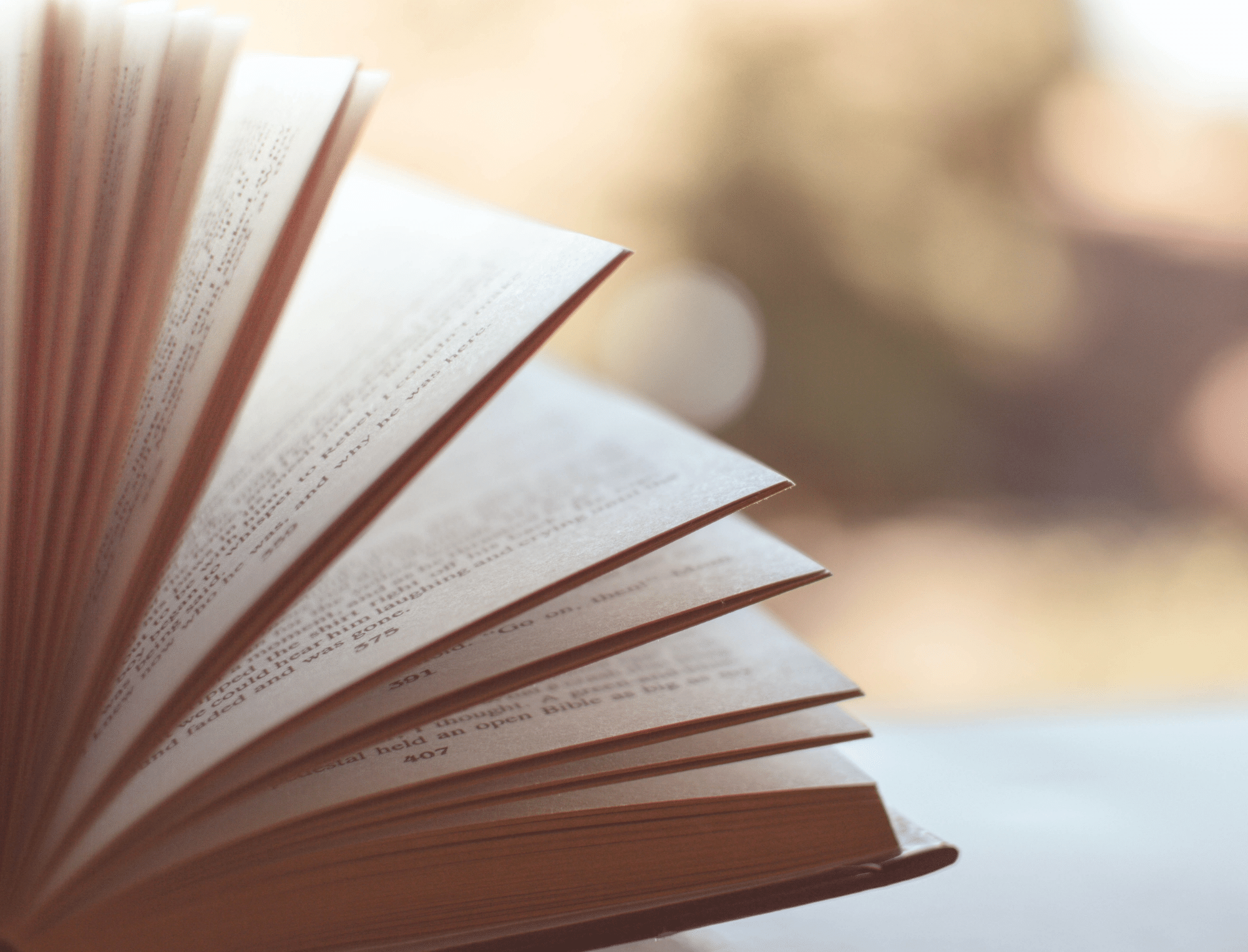 Close-up of book pages. Learn why book length matters with Publish Your Purpose
